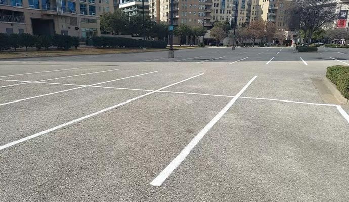 Empty parking lot with fresh white lines. Empty parking lot with fresh white lines.